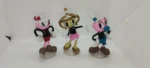 Cuphead og félagar. Bræðurnir Cuphead og Mugman með vinkonu sinni, henni Chalice. Stærð 14 cm Öll saman á 30.000 kr. Annars seljast þau á 12.000 kr. stk. hver um sig.